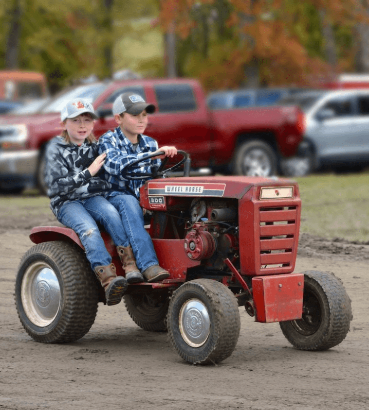 two kids on tractor